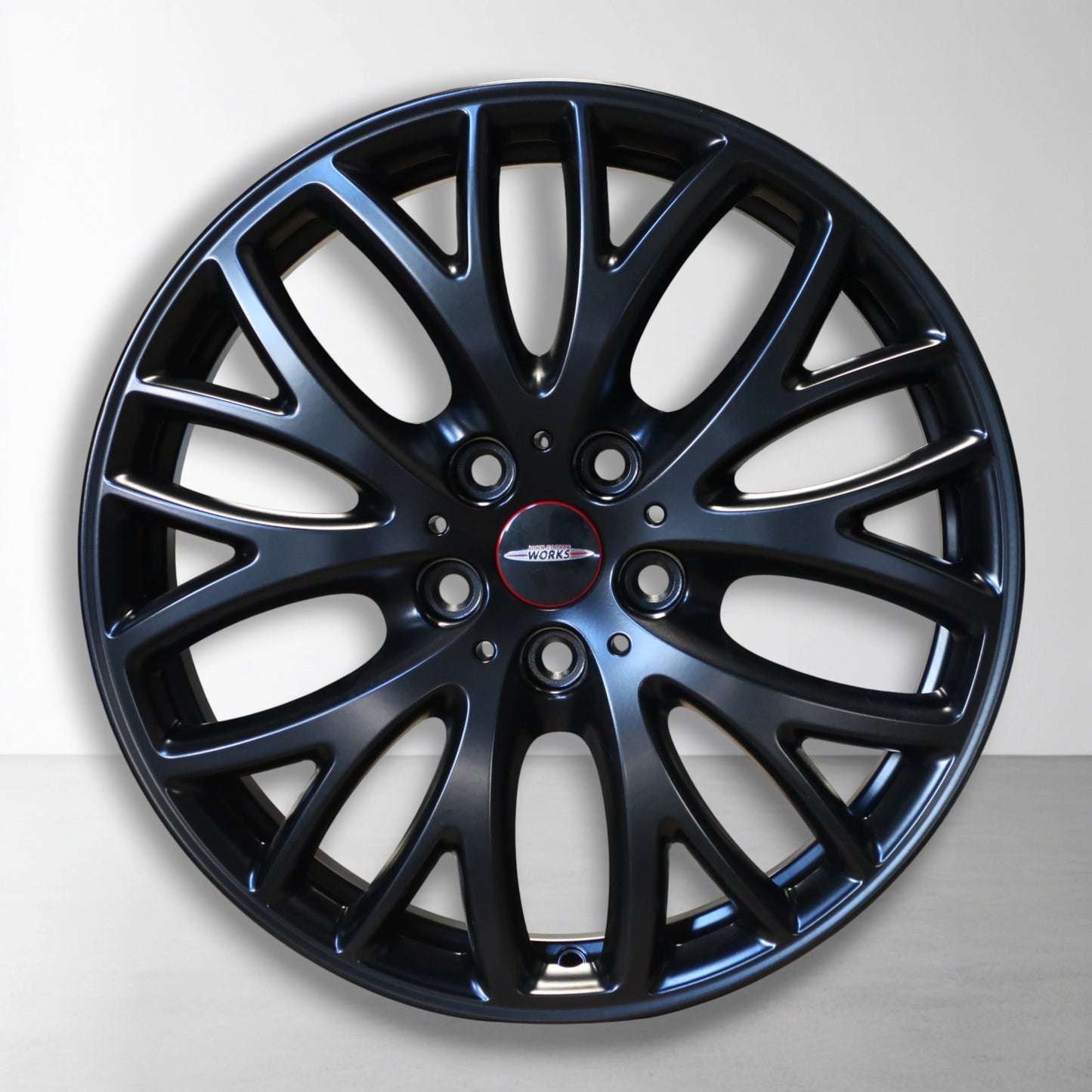 Enkele lichtmetalen velg met cross-spoke spaken, donkerblauw en zwart