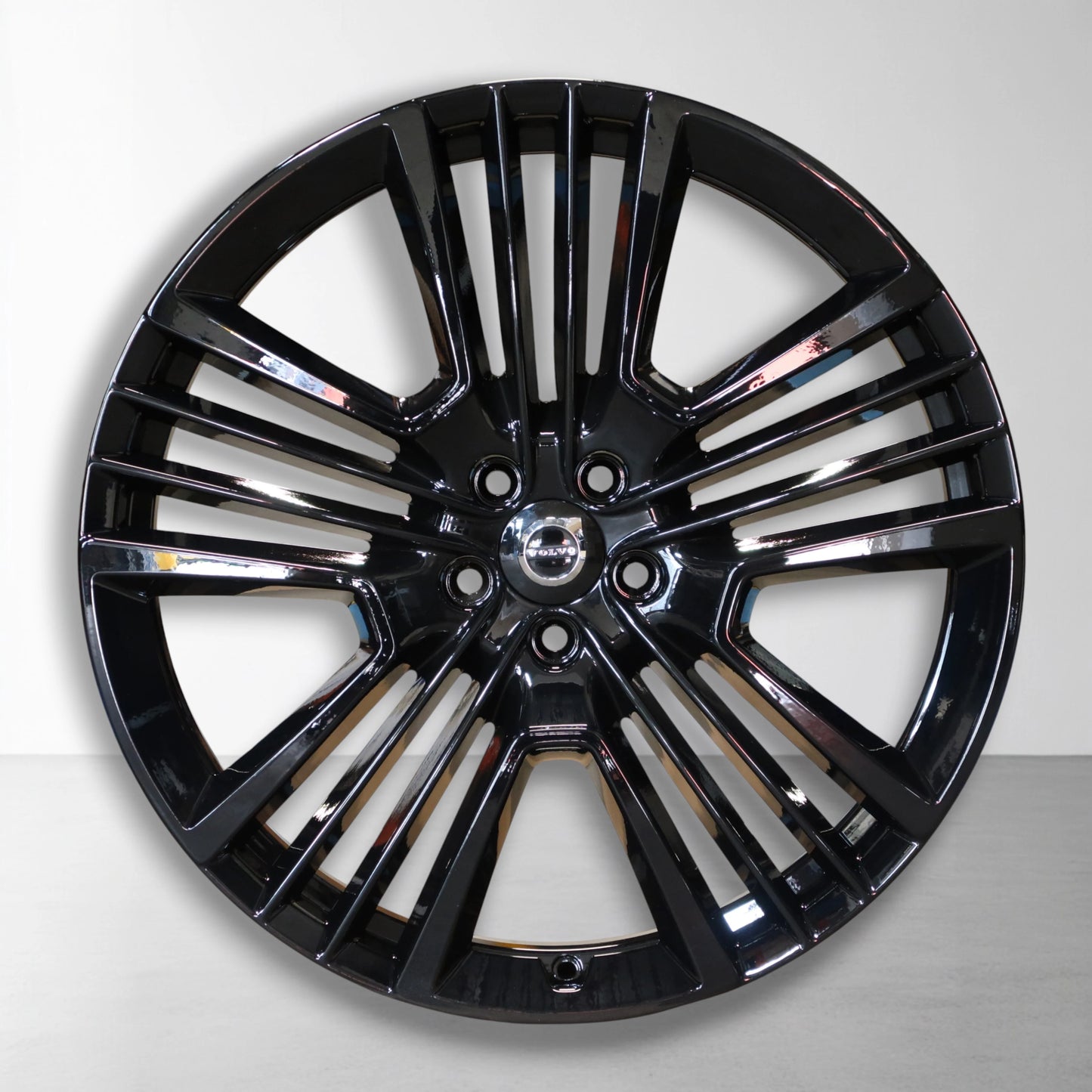 Originele 21 inch lichtmetalen velg met glanzend zwarte spaken en zilveren rand